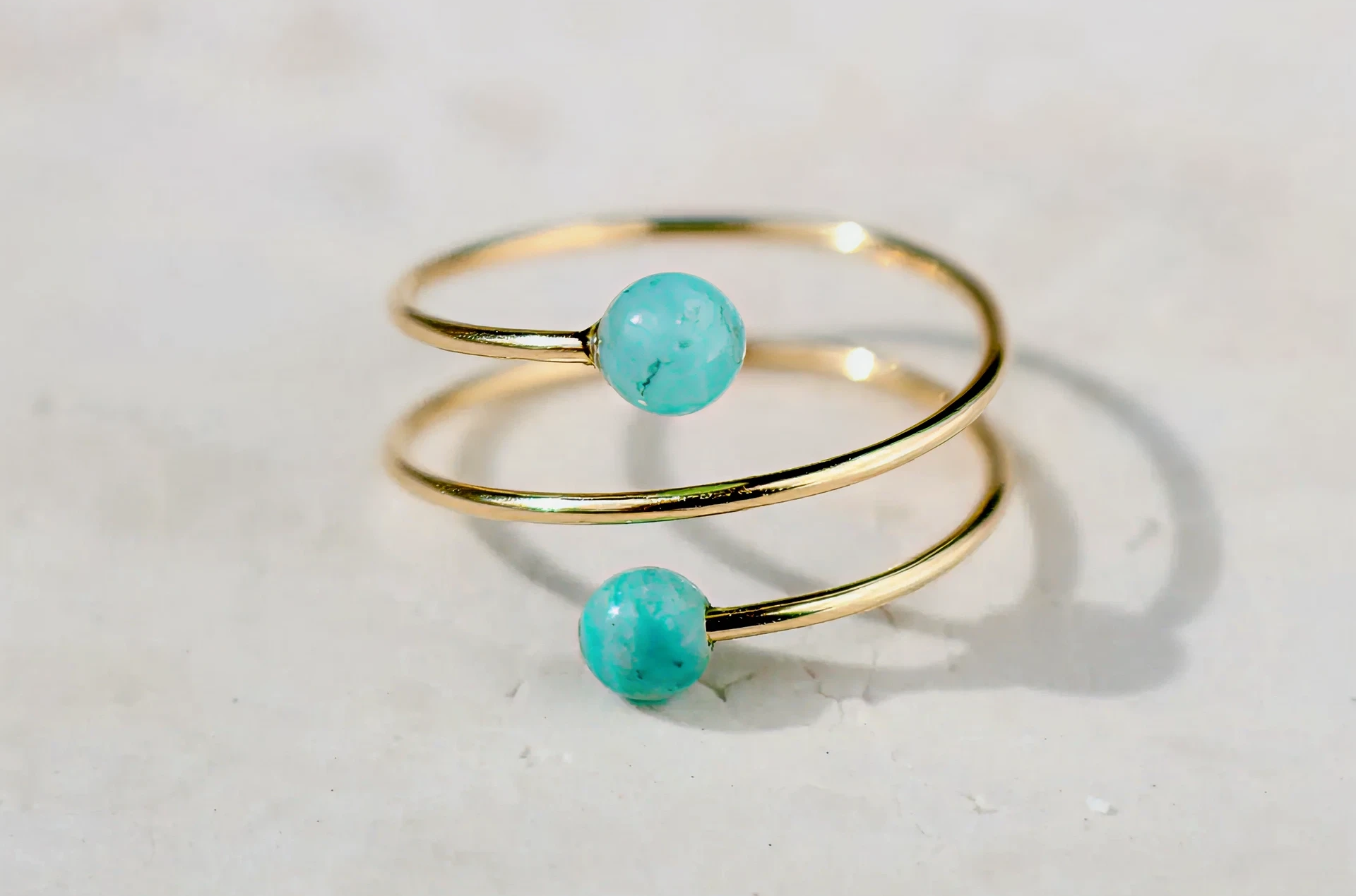 Gold spiral ring with turquoise beads